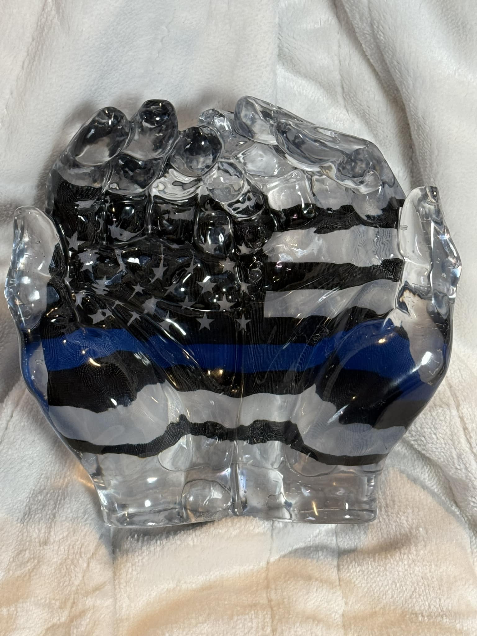 Hands cradling the Law Enforcement flag